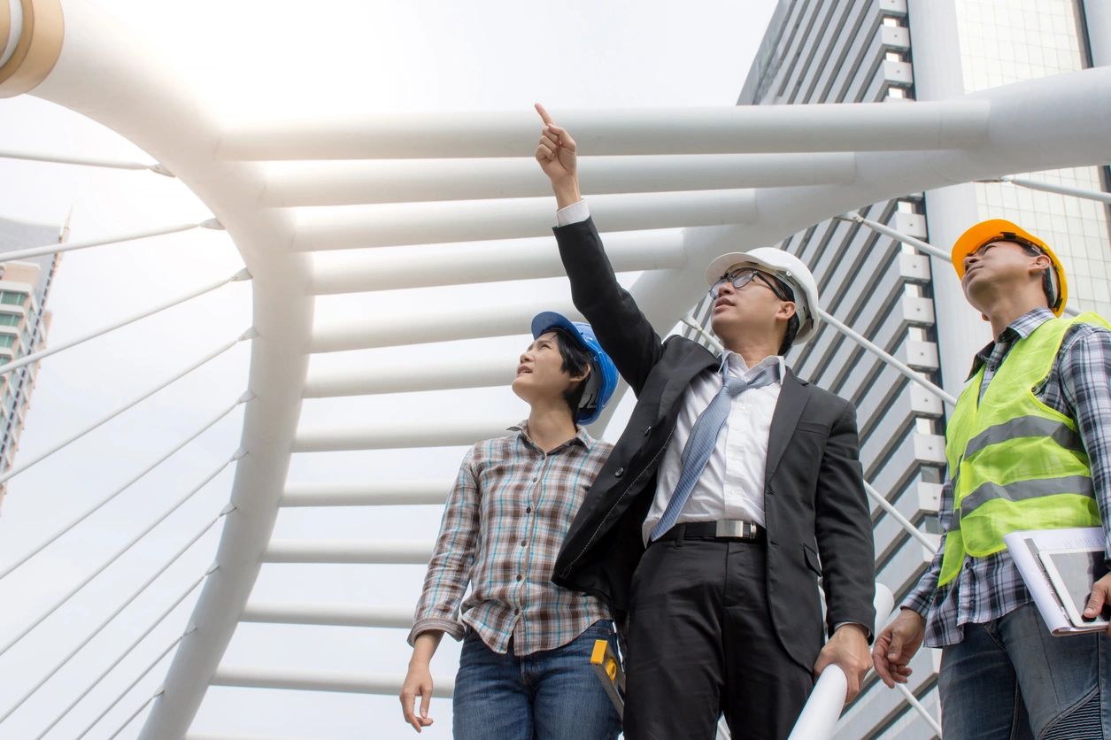 A man and woman looking up at something